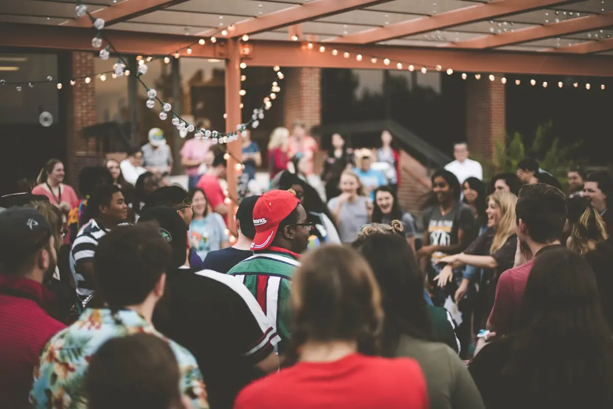 A garden party under string lights